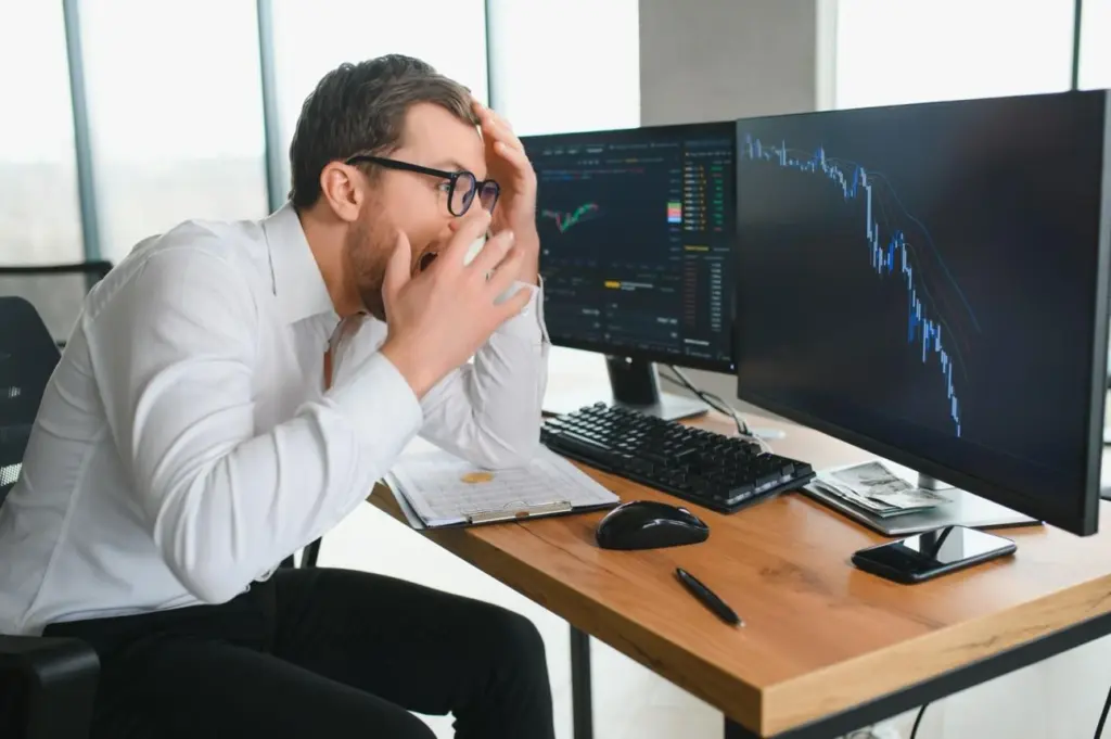 Crypto investor managing portfolio strategy during market downturn and losses