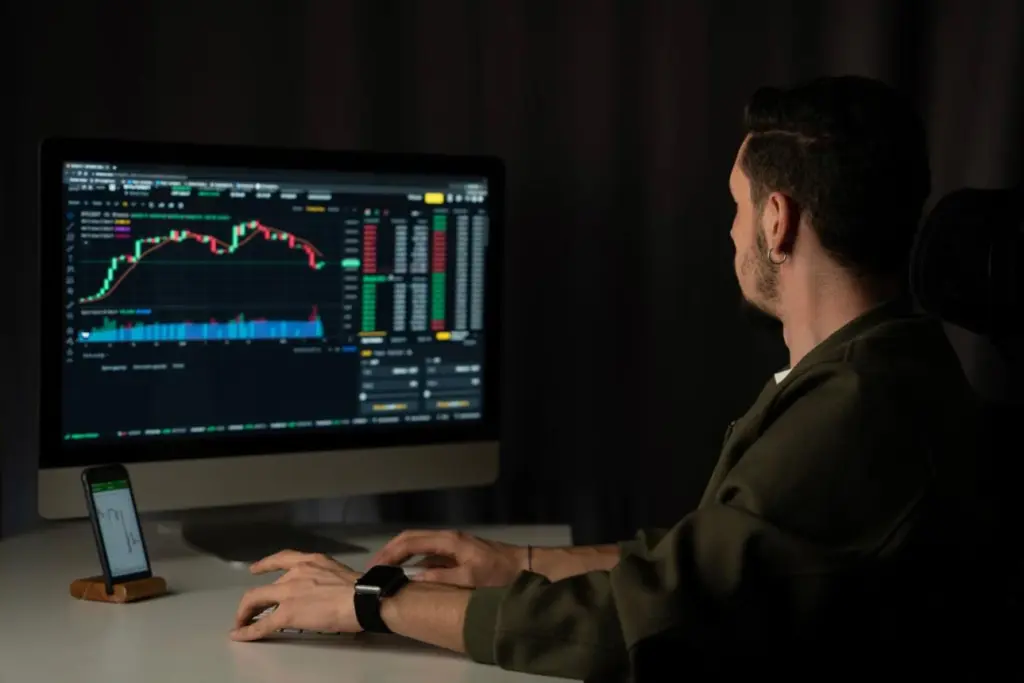 Financial analyst reviewing Bitcoin ETF outflows and institutional market data