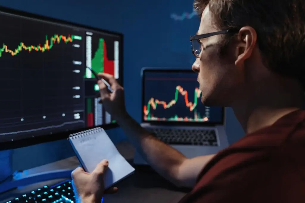 Trader analyzing potential crypto market recovery with emerging upward trend signals